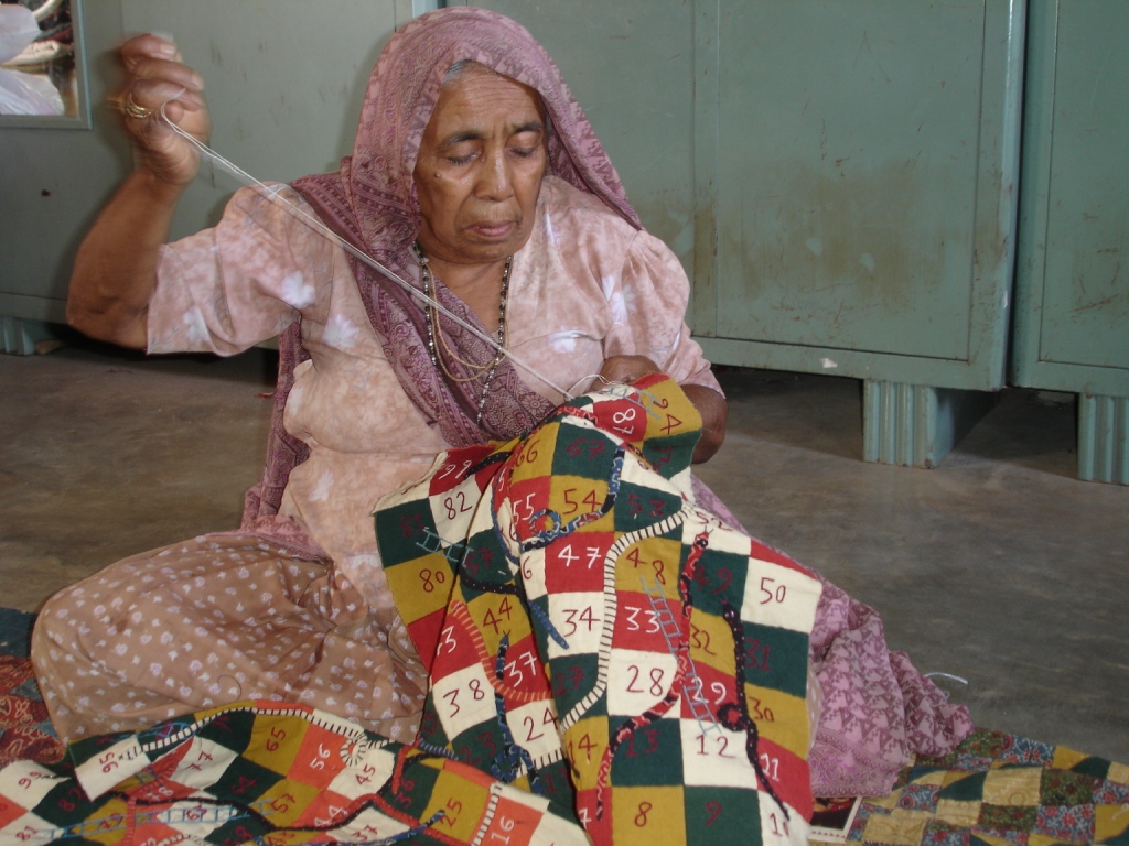 woman-artisan-making-a-fabric-game-board